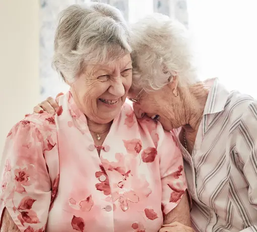 Two mature females laughing