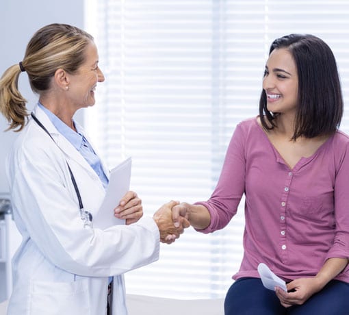 Infectious disease doctor shakes hand with patient