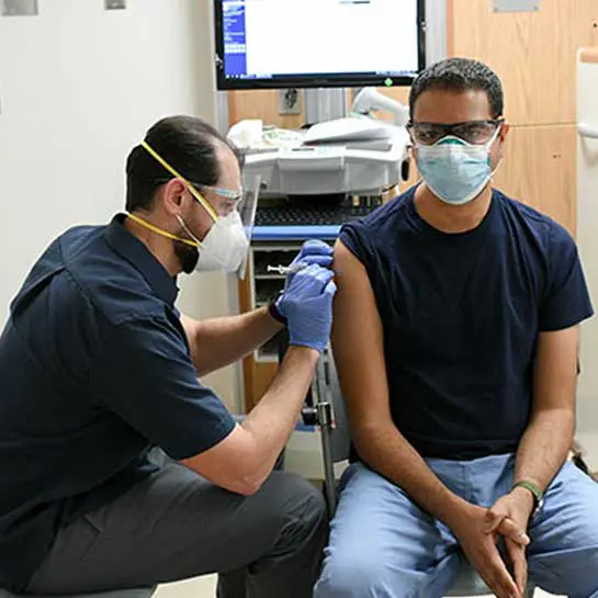 Dr Sukrut Dwivedi receiving his COVID-19 vaccination